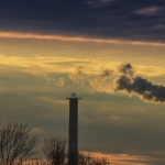 Heavy smoke spewed from coal powered plant smoke stacks