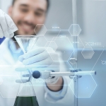 close up of scientist with test tubes and funnel