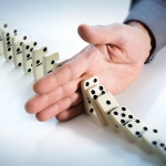 Stop Domino Effect – Hand Prevents Failure