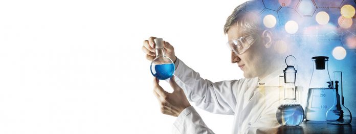 Silhouette of a chemist conducting experiments on the background