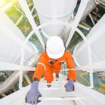 Production operator climb up to oil and gas process plant to obs