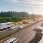 Lots of Trucks and cars on a Highway – transportation concept