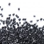 Polypropylene granule close-up background texture. plastic resin