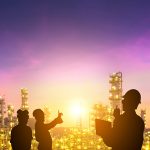 The silhouette of the engineering team is working at the oil and