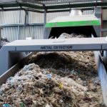Plastic being recycled compressed