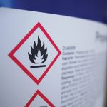 Flammable, acid, volatile, warning labels, mounted on hazardous