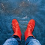 red rubber boots in the water