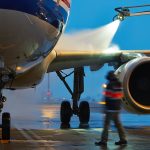 Winter,Time,At,The,Airport.,Deicing,Of,The,Airplane.