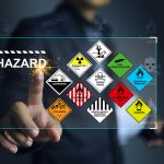 Hazardous substance concept engineer pointing on hazard icon dan