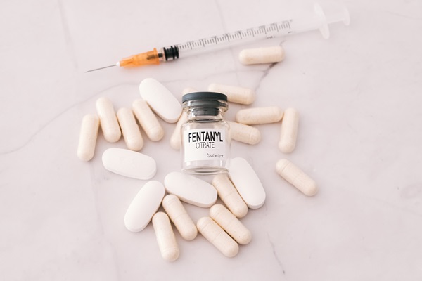 Fentanyl is a synthetic opioid narcotic used in medicine, vial isolated on white background.